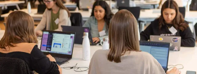 Data engineers and data scientists from latam working at the office.