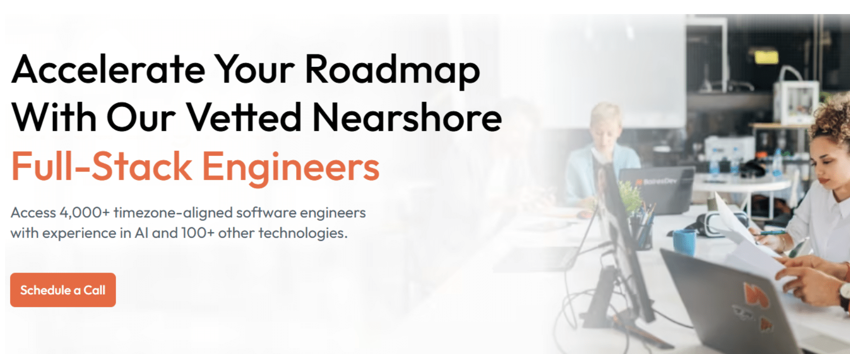 Hero section of a nearshore staffing website promoting vetted full-stack engineers in Latin America, featuring a modern office scene with software developers working and a call-to-action to schedule a call.